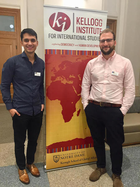 Graduate Students With Kellogg Institute Banner
